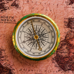 Compass on a world map