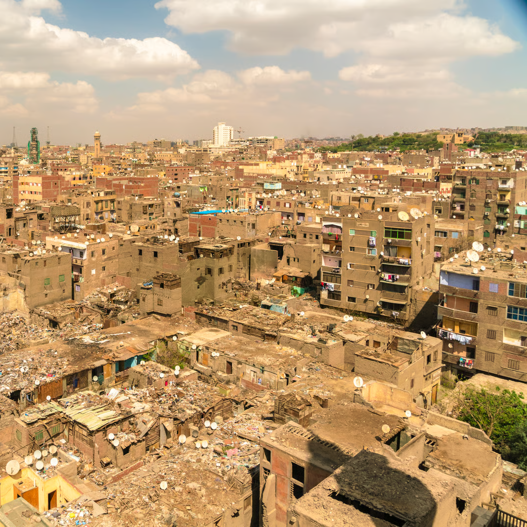 Aerial photograph of bombed buildings in Egypt, in a state of degradation.